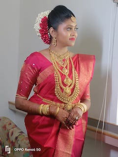 beautiful kerala bride wearing a red saree
